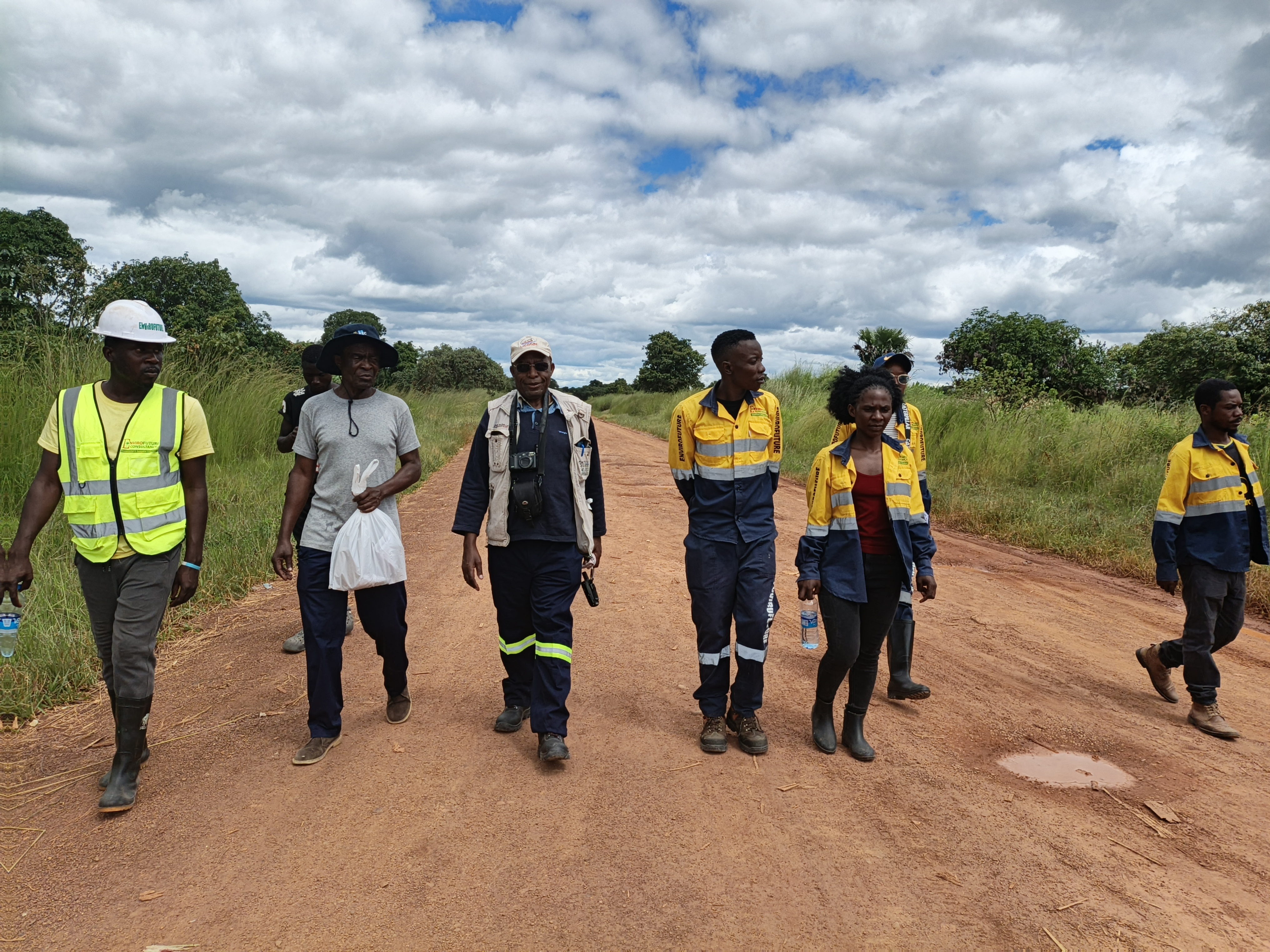 Field team walking a project access route